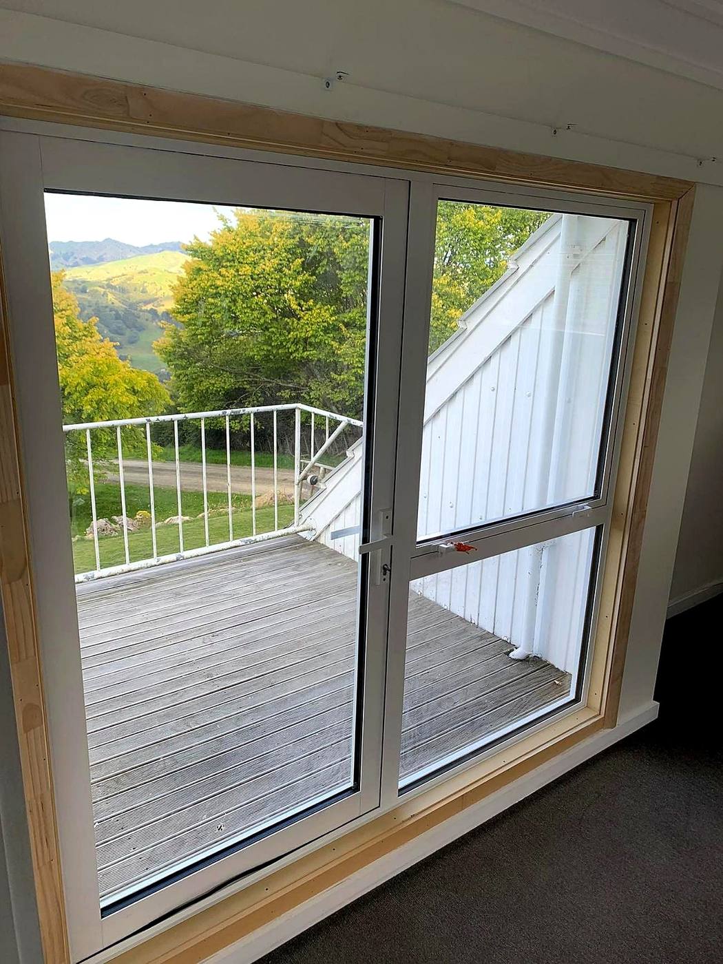 Finished sliding doors opening onto a new deck