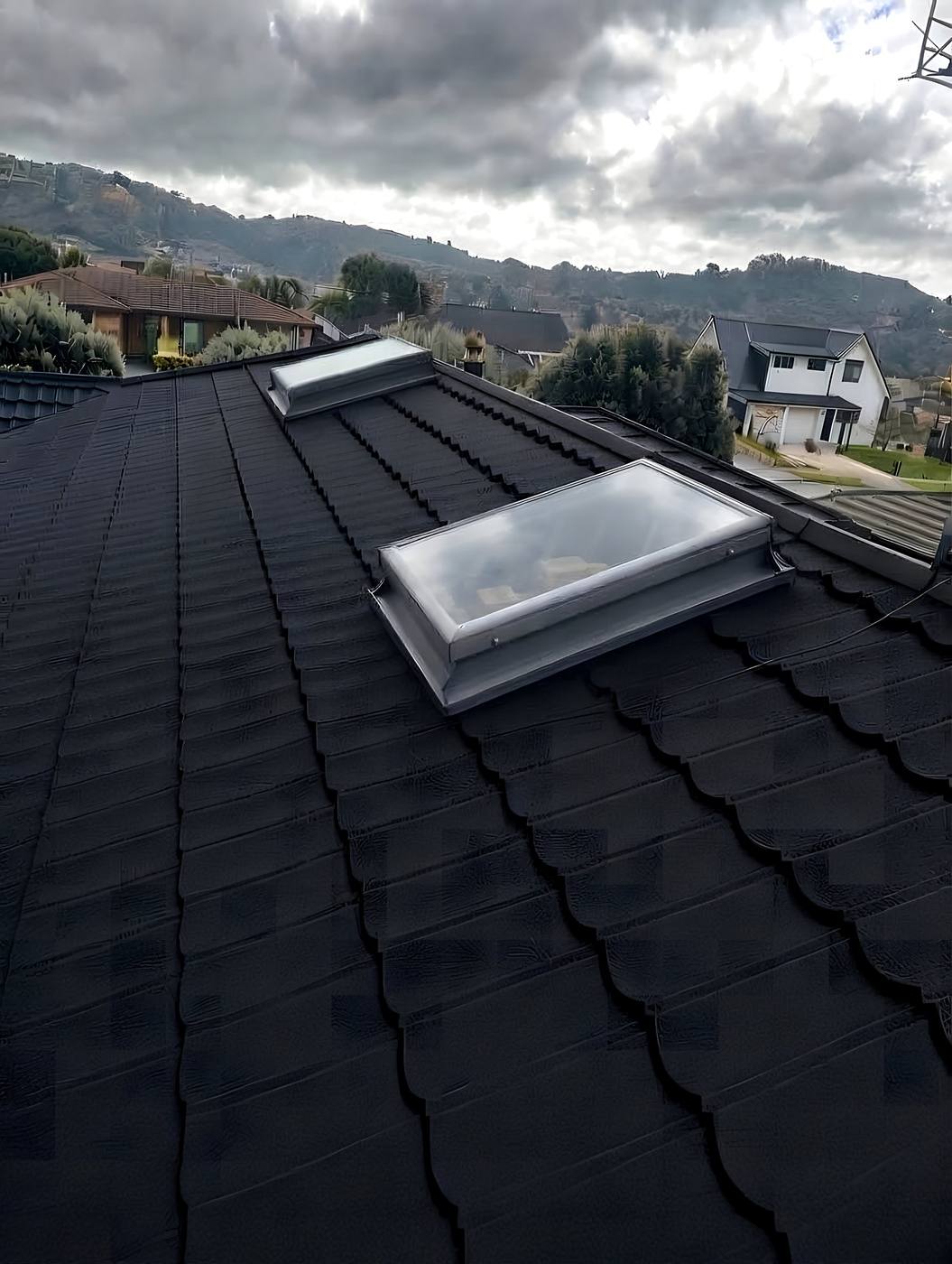 Concrete tile roof with two skylights fitted