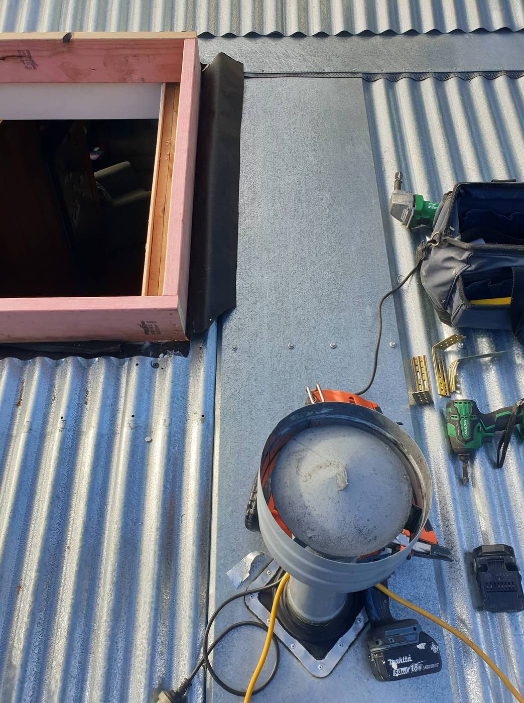 Roof penetration framed in and ready for flashing on a corrugated iron roof