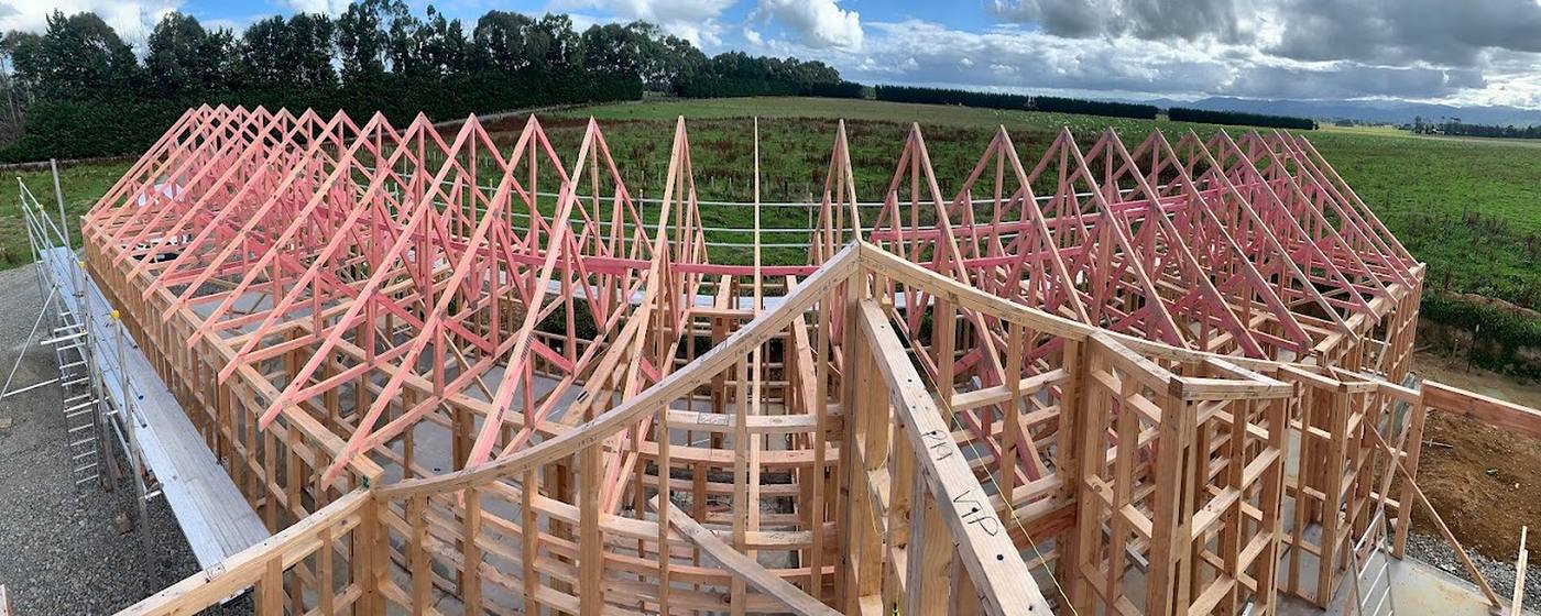 New roof truss framing in treated timber on a rural building site